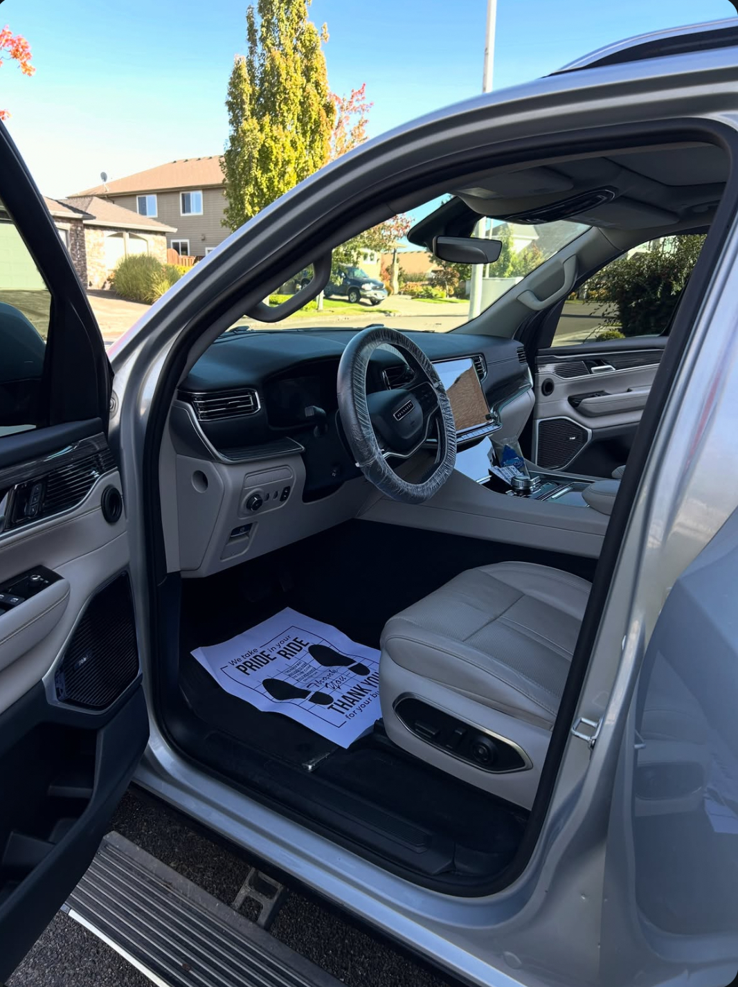 Grand Wagoneer interior with spotless light leather after an interior detail