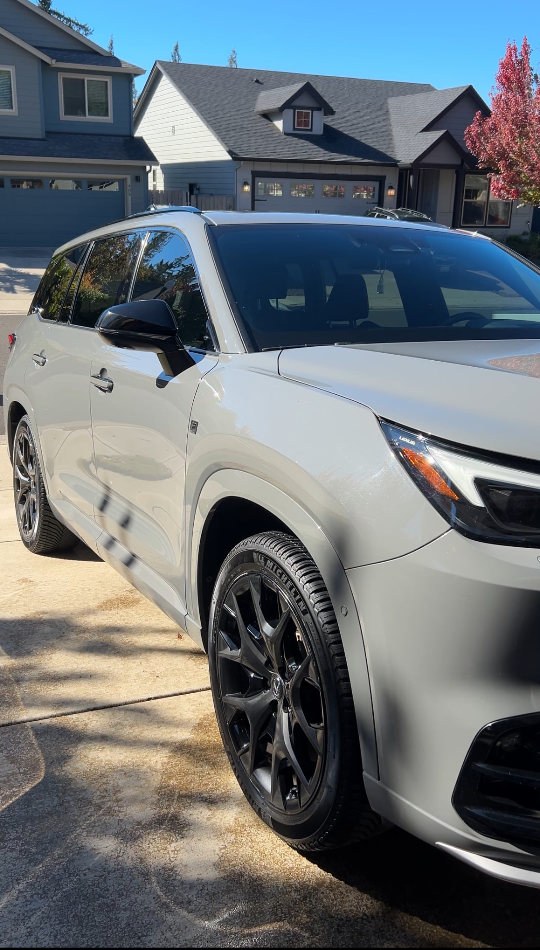 Gray Lexus TX with glossy paint and black wheels after a mobile detail in a Vancouver, WA driveway
